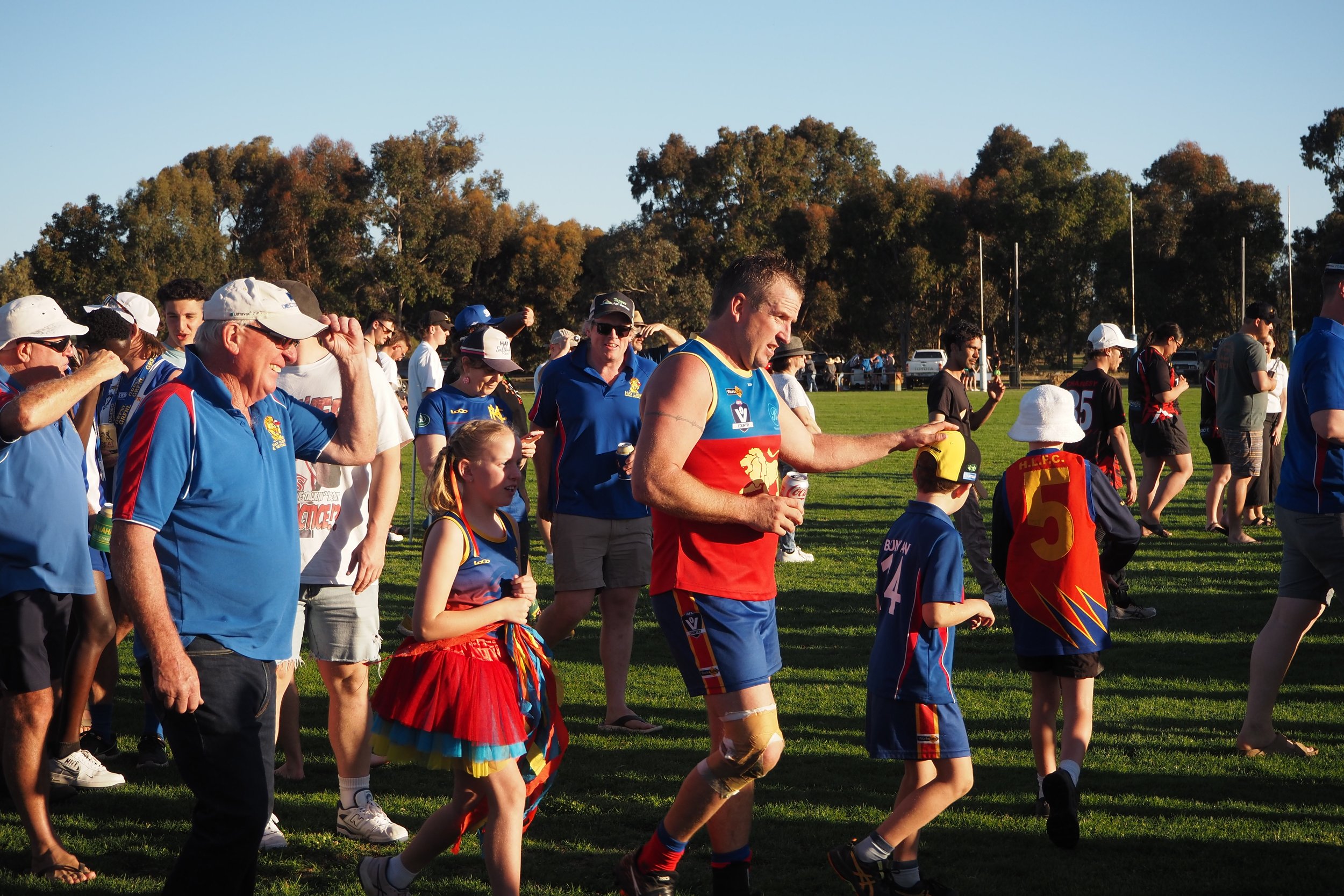simon bunyan and kids coming off field lions gf 2023.jpg