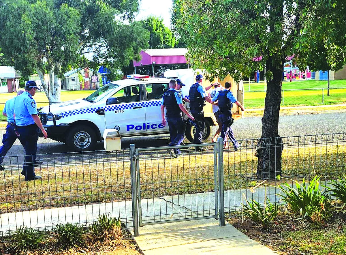 Community rally behind police in fugitive arrest